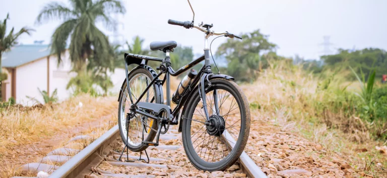 A Karaa e-bike on a railway line in Kampala