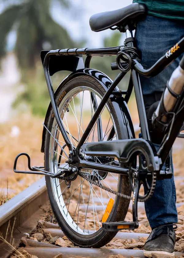 The rear wheel and chain guard of a Karaa e-bike