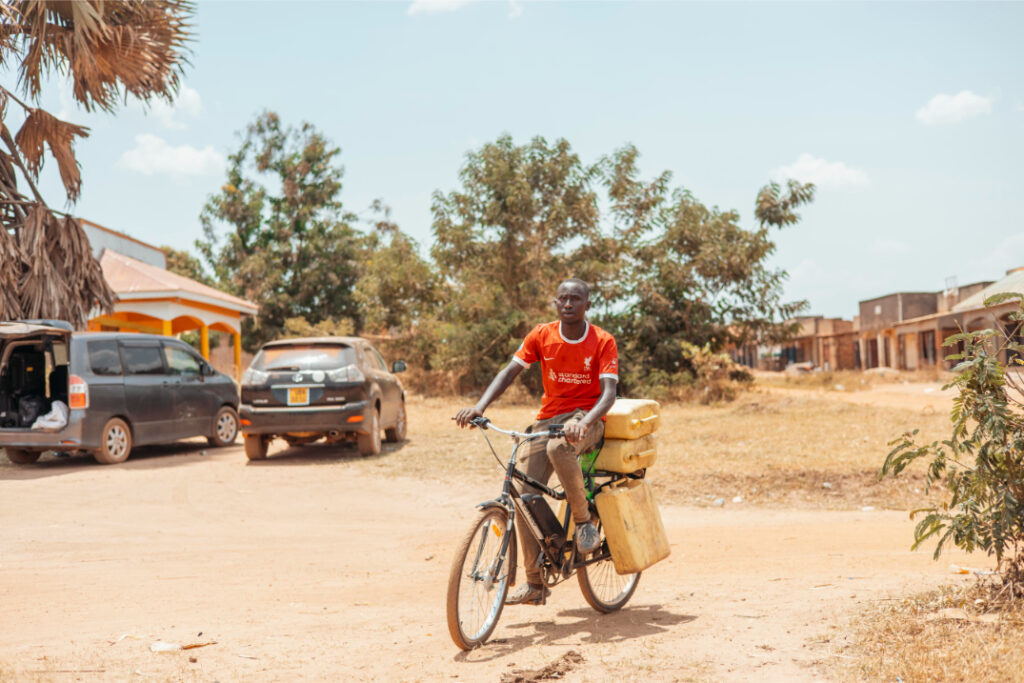 A rider transporting water on a Karaa e-bike