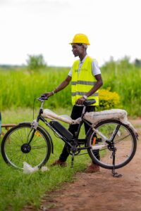 Karaa team member walking with an electric bike