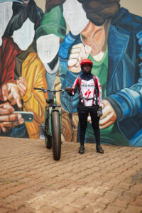 A rider standing with a REF fat bike converted to electric with the Karaa kit